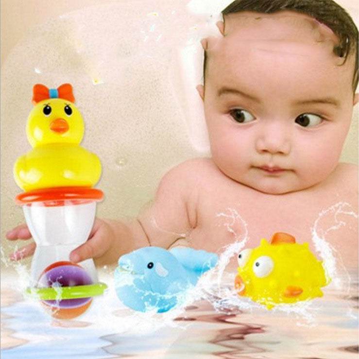 Baby Playing In The Water With A Duck Toy - Mubimart